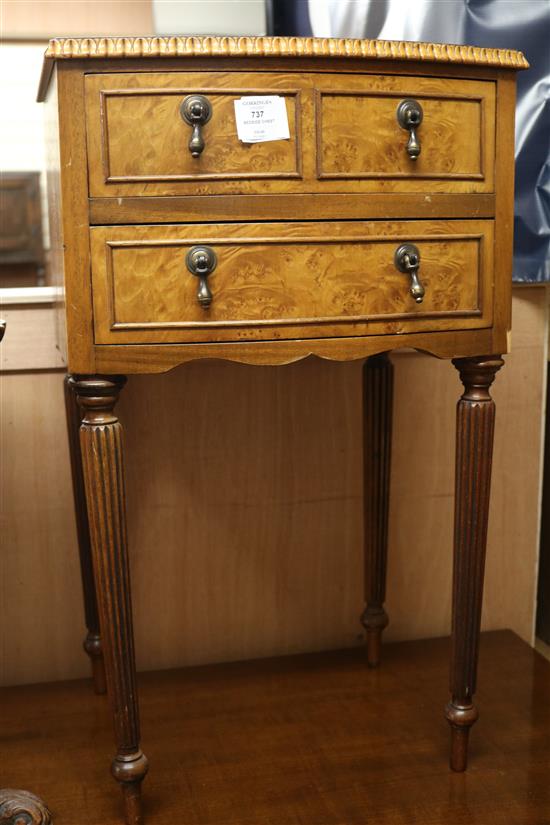 A small burrwood bowfronted bedside chest, of three drawers, W.1ft 5in.